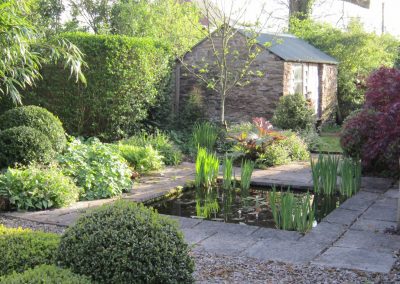 A small formal pond and surrounding planting