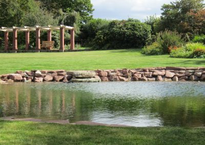 Pergola reflected in the swimming pond