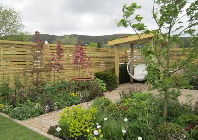 Bubble chair hanging from the arbour