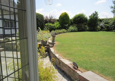 oval lawn with inuit welcome statue